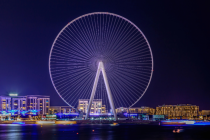 A dazzling night view of Ain Dubai, the world’s largest observation wheel, glowing with lights on Bluewaters Island — one of the top must-see things in Dubai, offering breathtaking skyline views, thrilling rides, and unforgettable nighttime experiences.