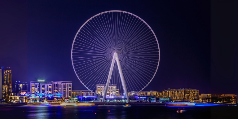 A dazzling night view of Ain Dubai, the world’s largest observation wheel, glowing with lights on Bluewaters Island — one of the top must-see things in Dubai, offering breathtaking skyline views, thrilling rides, and unforgettable nighttime experiences.