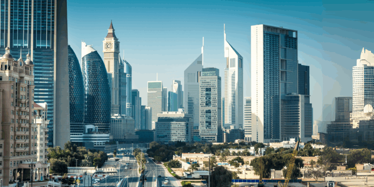 Daytime view of Dubai’s central business district featuring modern skyscrapers, including Emirates Towers and nearby high-rise architecture, with minimal traffic and clear skies—ideal conditions for off-season travel in Dubai.